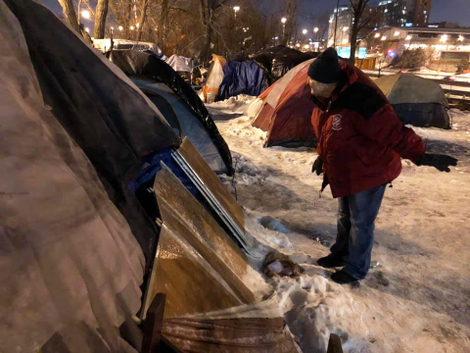 Someone with the Salvation Army going tent by tent to inform people of their options.